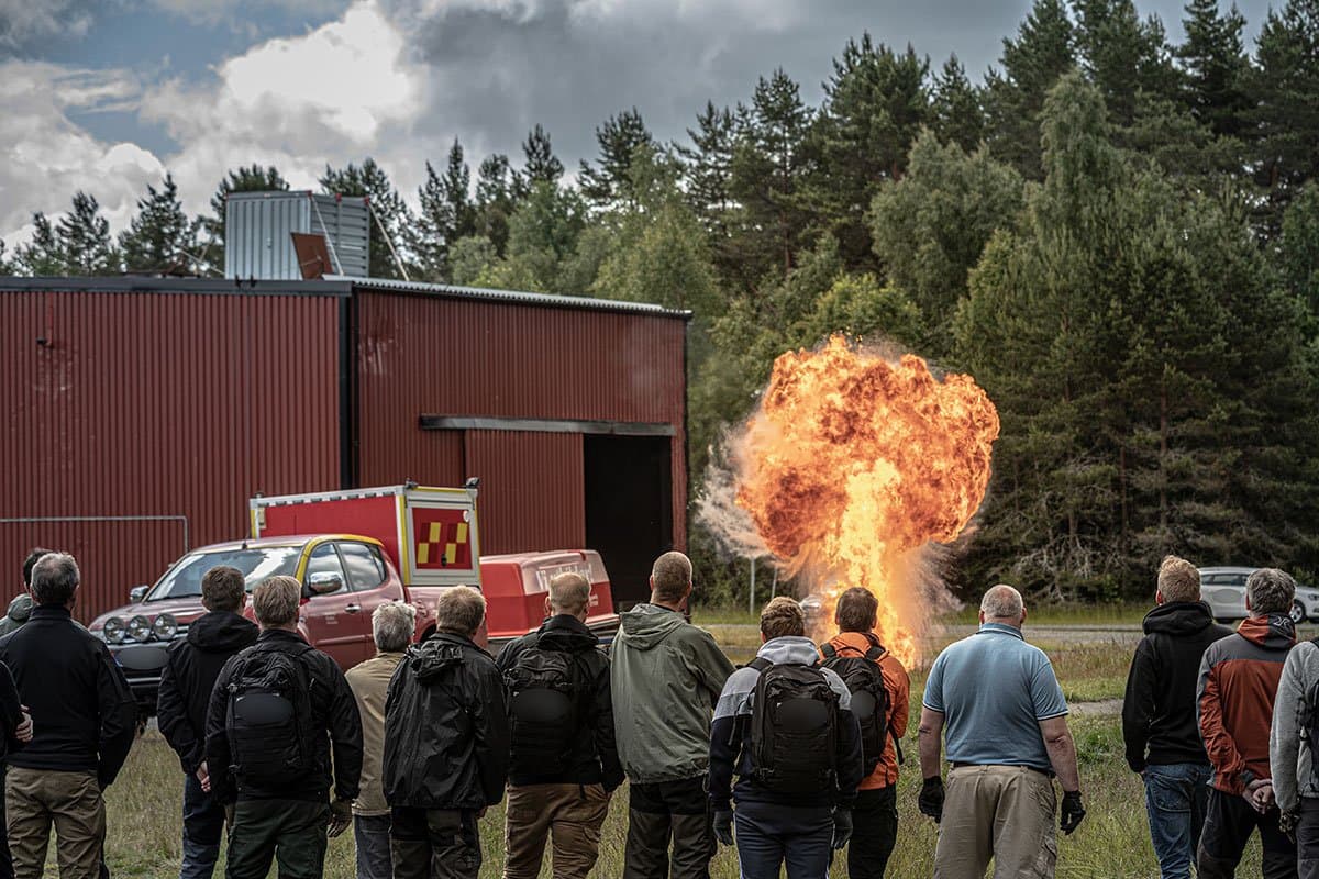 Participants watching a controlled blast during an exercise