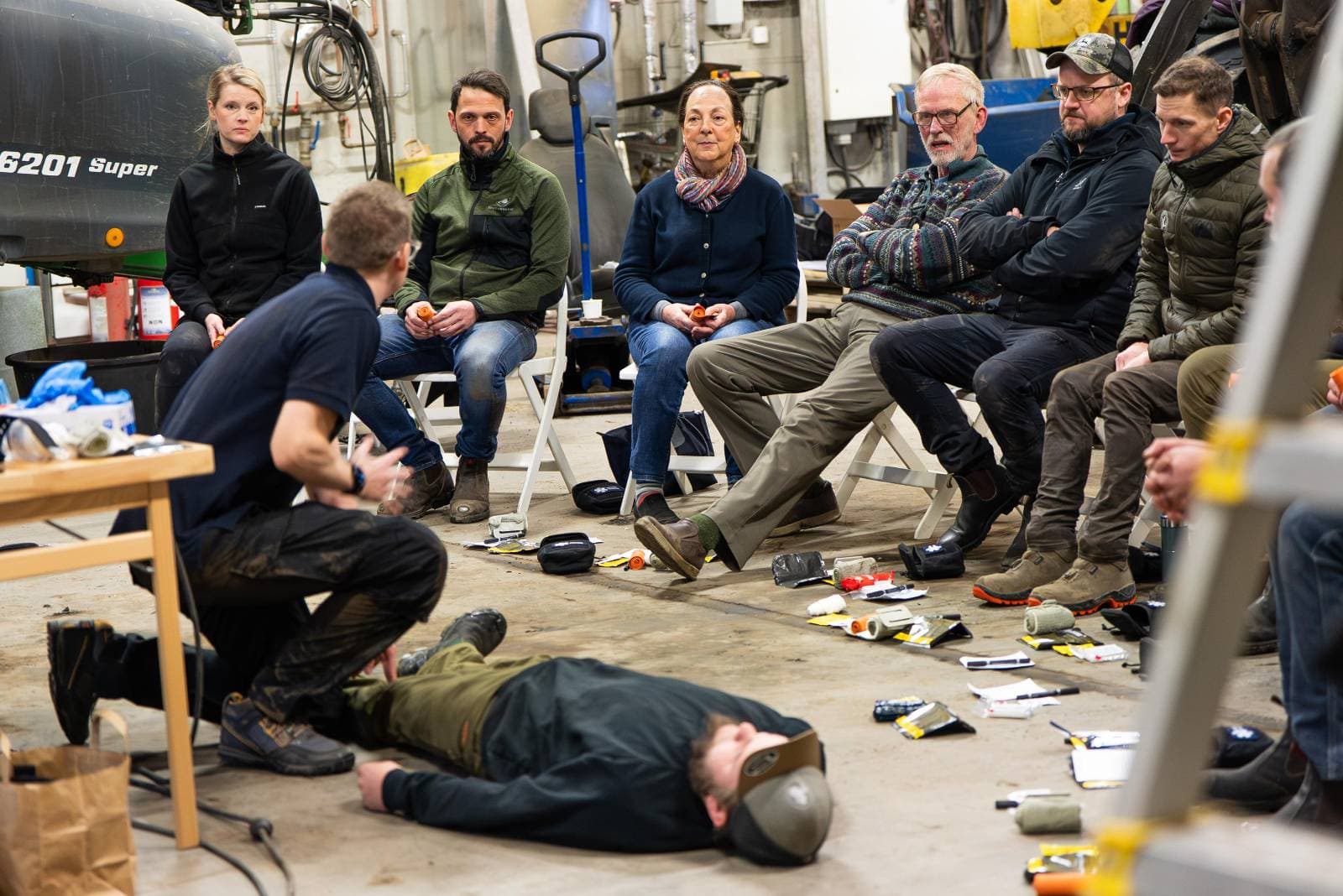 First-aid demonstration for participants in a workshop setting
