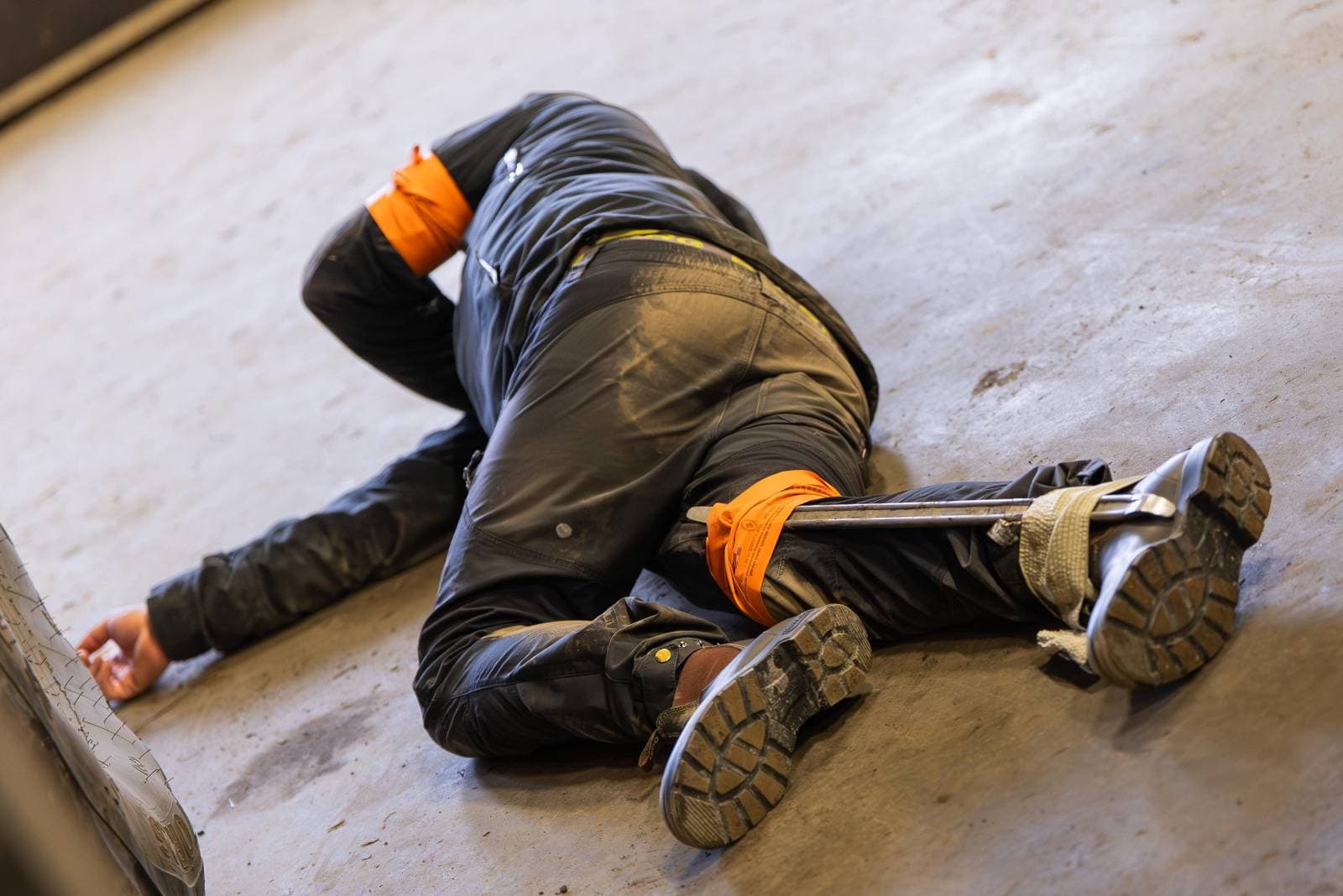 Simulated casualty with tourniquet and splint during an exercise